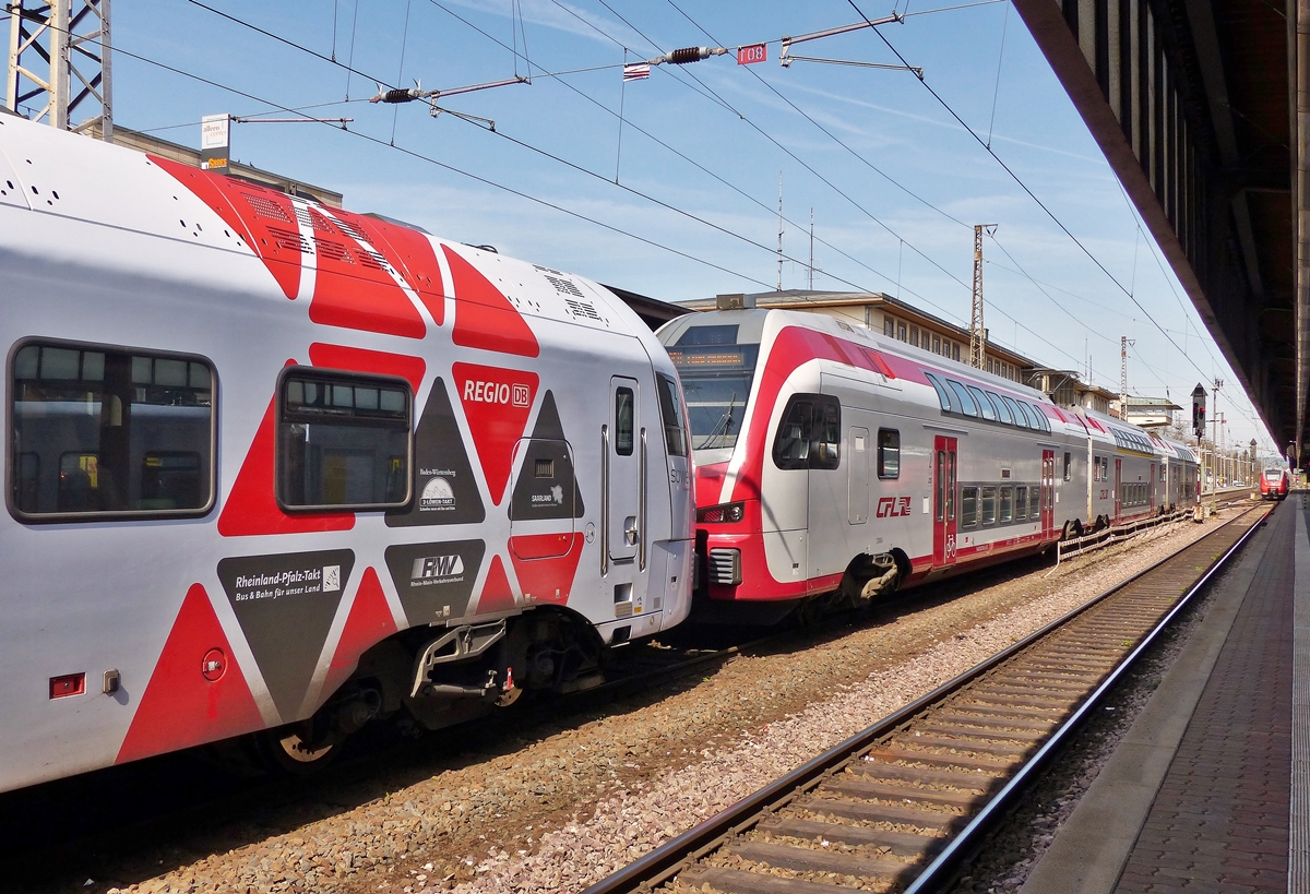 . Der 5-teilige FLIRT der DB Regio und der KISS 2306 der CFL fahren zusammen gekoppelt am 10.04.2015 in den Trierer Hauptbahnhof ein. Sie kommen aus Koblenz und werden in Trier getrennt. Der S�WEX f�hrt weiter nach Mannheim, w�hrend der KISS nach Luxembourg f�hrt. (Jeanny)