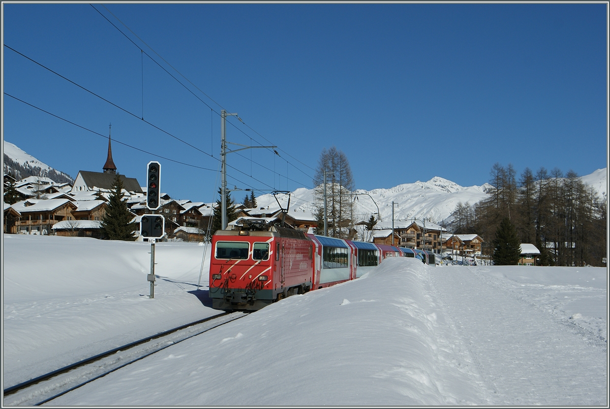 Der Glacier Express 903 von St. Moritz nach Zermatt passiert gerade das Einfahrsignal A (mit dem Ausfahrvorsiganl C*) bei Münster VS.
20. Feb. 2014