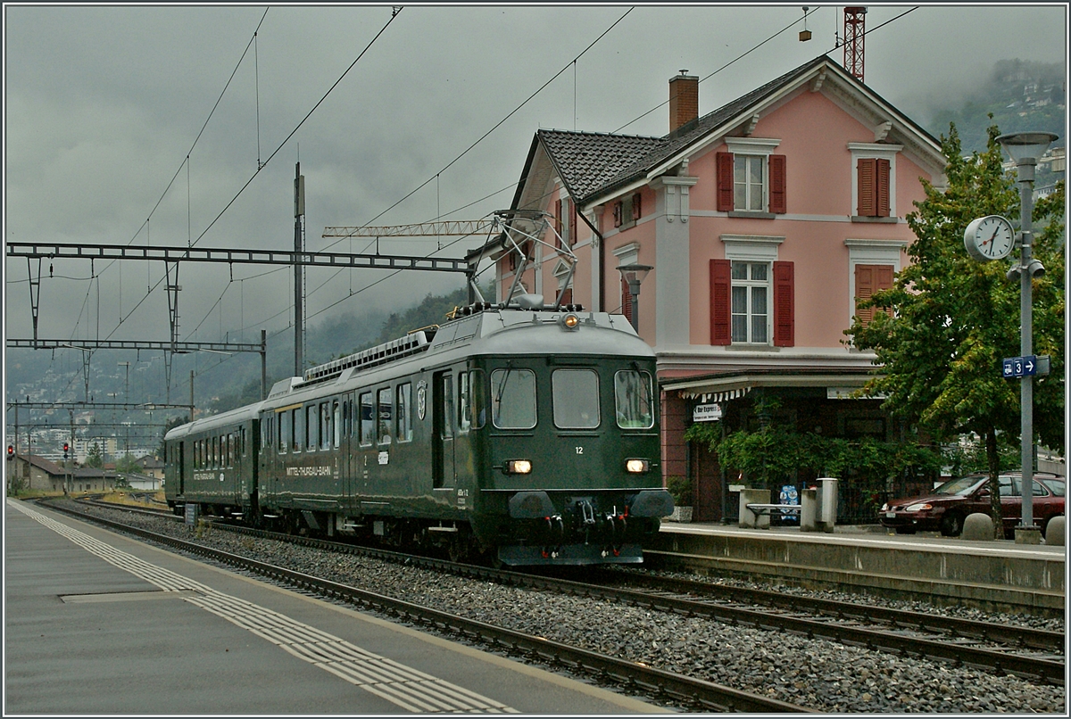 DER MThB ABDe 4/4 12 und BDt bei der Durchfahrt in Tenero.
15. Sept. 2013