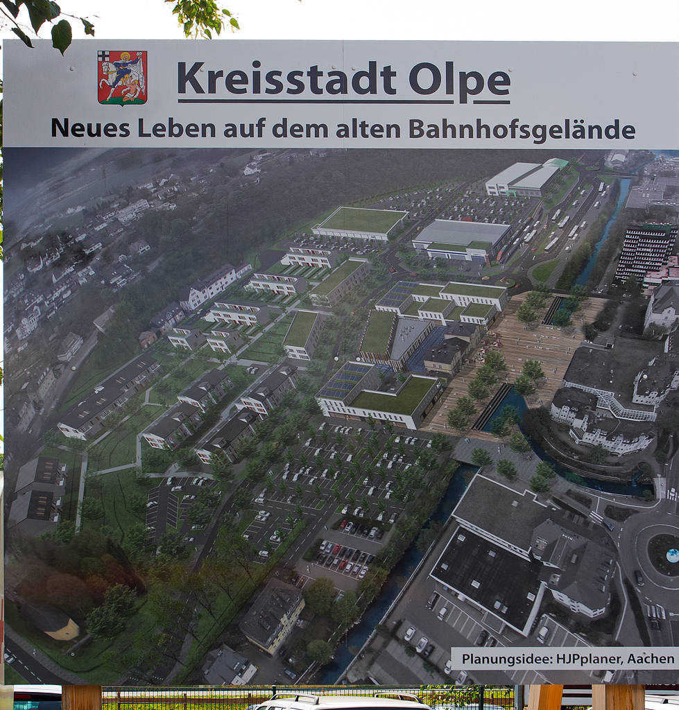 
So soll es aus der Vogelperspektive einmal aussehen...
Der ehemaligen Bahnhof Olpe, an der KBS 442  Biggetalbahn  (Finnentrop - Olpe - (Freudenberg)). Aufgenommen am 26.07.2014. 
Oben rechts der neue Haltepunkt Olpe und etwas unterhalb der ehemalige Bahnhof eingebettet zwischen Neubauten.
