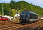 Die MRCE 185 569-1 (vermietet an Neusser Eisenbahn) f�hrt am 04.07.2012 solo durch Linz in Richtung Norden.